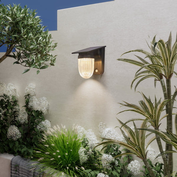 Upside-down solar planet wall lamp glowing in warm white, perfect for gardens and patios.