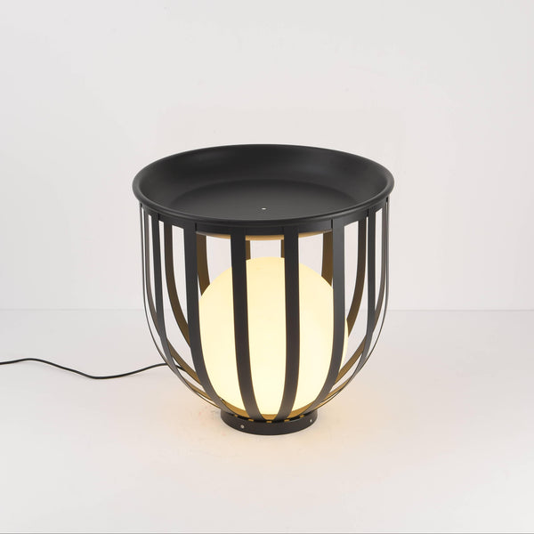 Close-up view of indoor floor lamp and matte metal top.