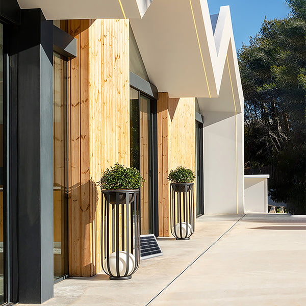 Modern solar pathway light with motion sensor for enhanced security.