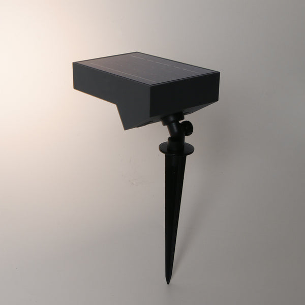 Solar-powered spot light with adjustable angle for landscape lighting.