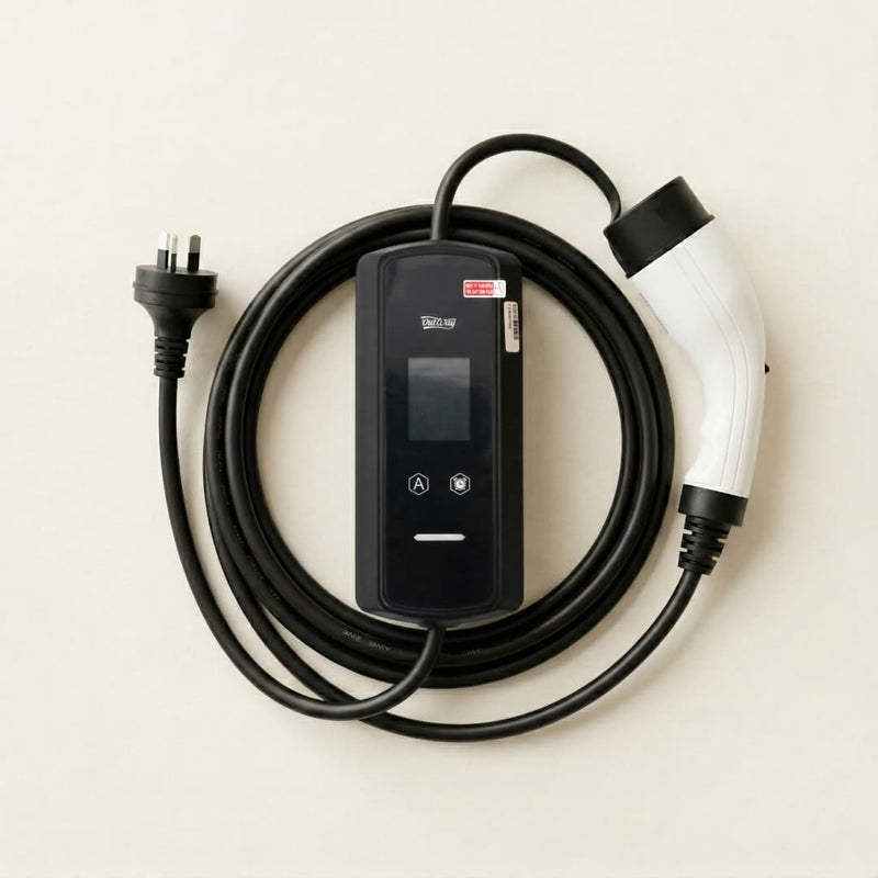 Electric vehicle charging cable with black control box and white connector on a beige background