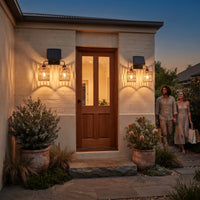 Dual-head solar wall sconce flanking wooden front door at dusk — symmetrical installation enhances curb appeal, with UV-resistant rattan shades and anti-rust bracket built for Australian outdoor conditions.