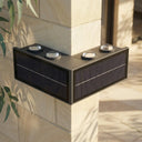 Grivo Solar Corner Wall Light PT0803 mounted on a 90-degree L-shaped outdoor corner, casting warm 3000K up and down lighting on white rendered walls and travertine paving at dusk.