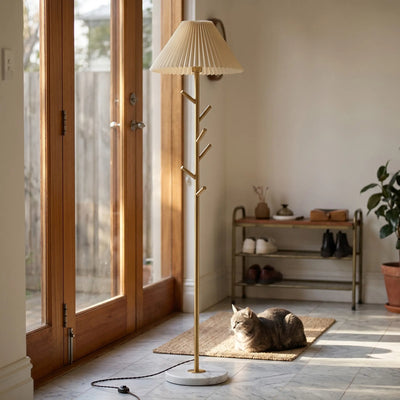 Modern gold floor lamp with pleated fabric shade, 2-in-1 coat rack and light, marble base, indoor home decor for entryway or living room, warm ambient lighting with cat resting nearby