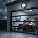 Outway motion sensor with IP65 rating illuminating garage under heavy rain