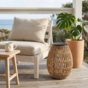 PT0906 solar handwoven garden path light on wooden deck beside armchair, PE rattan construction, solar panel top, coastal outdoor decor, UV-resistant garden lighting