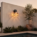 Two-light solar fixture above poolside planter at twilight — highlights minimalist architecture with textured light patterns, perfect for modern courtyards needing both function and mood lighting.