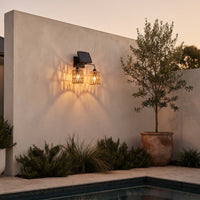 Two-light solar fixture above poolside planter at twilight — highlights minimalist architecture with textured light patterns, perfect for modern courtyards needing both function and mood lighting.