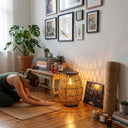 Woman doing yoga indoors with PT0906 solar lantern as ambient floor lamp, boho home decor, warm lighting for relaxation, USB-C rechargeable garden light used indoors