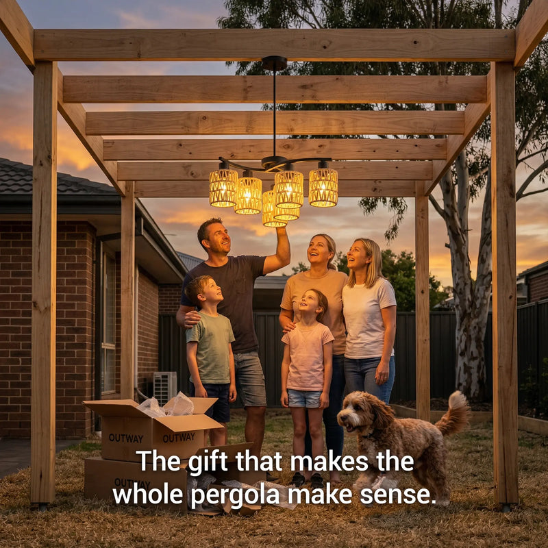 Family of five with a dog standing under a wooden pergola at sunset.