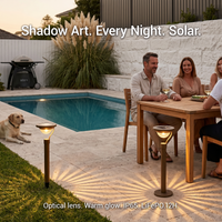 Solar garden lights arranged beside a wooden dining table during an outdoor dinner party, with text overlay “Shadow Art. Every Night. Solar.” and specs “Optical lens. Warm glow. IP65. LiFePO₄. 12H.” — showcasing their role in elevating social gatherings with artistic, long-lasting illumination.