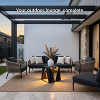 Outdoor lounge area with furniture and decor on a patio.