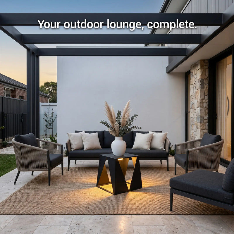 Outdoor lounge area with furniture and decor on a patio.