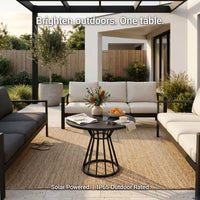 Outdoor patio setting with a solar-powered table and furniture.
