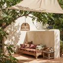 PT0913 solar rattan pendant light with separate solar panel in an outdoor garden seating area
