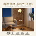 FL068 gold arc floor lamp with wood tray standing in a brick-wall living room at night, warm 3000K glow, feature badges: SAA, 3 colour temps, 260° adjust, wood tray, foot switch