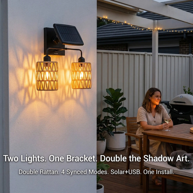 Solar wall lights on a wall with outdoor setting and woman sitting at a table.