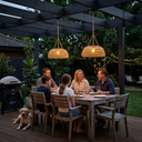 Two PT0901 Solar Rattan Lanterns glowing over a family dinner under a pergola at dusk, emphasizing their 8–10 hour runtime and 3-color temperature settings (3000K/4000K/6000K) for mood lighting.