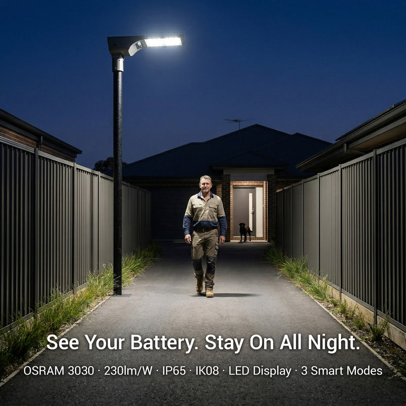 Person walking on a path illuminated by a street light with text about battery life and features.