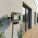 Outway motion sensor floodlight wall-mounted in a modern Australian home exterior.