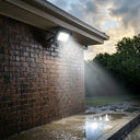 Outway motion sensor floodlight mounted on a brick wall.