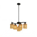 Outway PT0912 solar rattan pendant light six heads glowing evenly under timber pergola string lights visible beyond evening sky