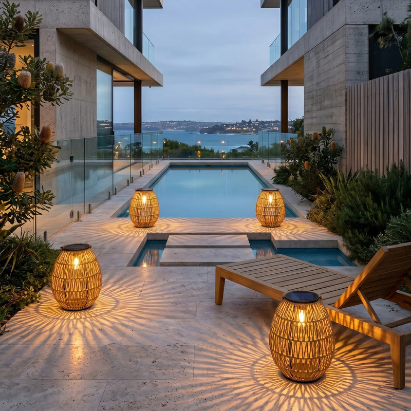 PT0906 solar garden lights casting woven shadows by luxury pool, modern villa outdoor lighting, evening ambiance with ocean view