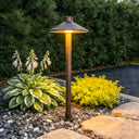 An outdoor lamp equipped with a solar panel, promoting sustainable energy use.