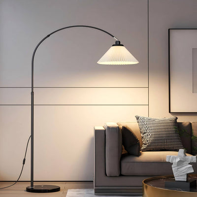 Modern living room with a floor lamp and a sofa.