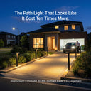 Modern house with well-lit driveway and pathway at night, featuring text about path light quality.