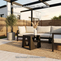 Outdoor patio set with solar-powered table and sofa on a sunny day.