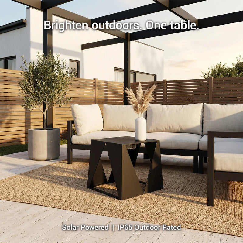 Outdoor patio set with solar-powered table and sofa on a sunny day.