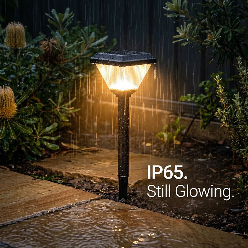 Garden light post with rain falling around it, labeled IP65.