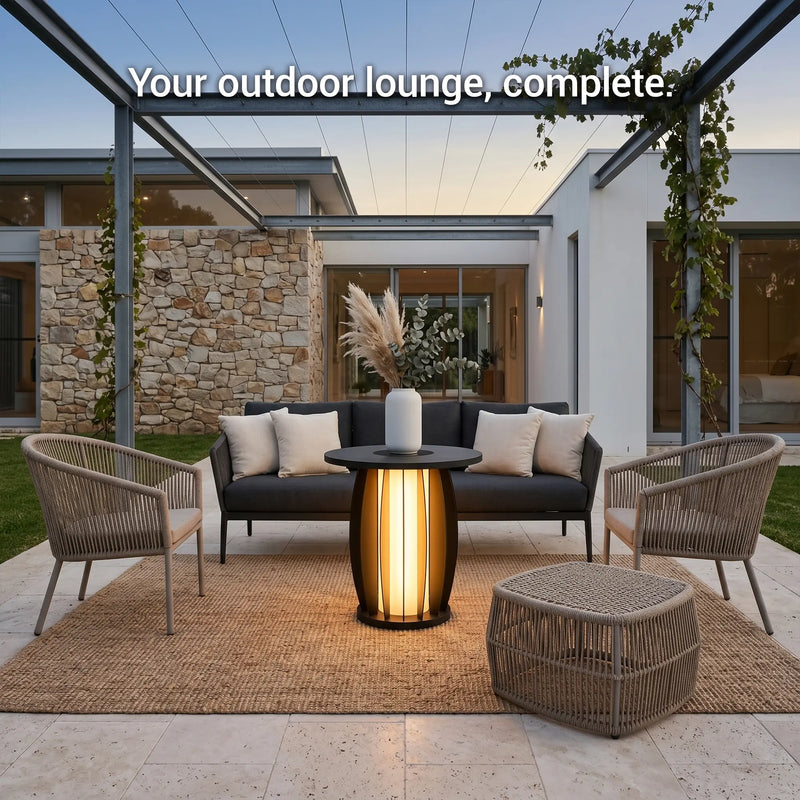 Outdoor lounge area with furniture and lighting in a modern backyard setting.