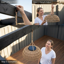 Woman installing the PT0901 Lantern via hook on a pergola beam, reinforcing the “30-Second Installation. Zero Tools.” selling point for renters and DIY homeowners.