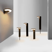 Modern outdoor solar lawn & wall lights on a white surface with a gray background