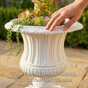 Close-up of hand touching hand-carved Roman fluted rim of white OUTWAY Flora planter with succulents and string of pearls, caption: "Hand-Carved Lines. Not a Mould." — F004-flora-planter-fluted-rim-handcarved-detail-succulents