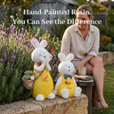 OUTWAY Hoppi A004 solar bubble rabbit standing and sitting ornament pair in a lavender garden with a monarch butterfly and a woman sitting on a bench with a coffee cup with text overlay Hand-Painted Resin You Can See the Difference