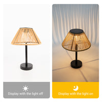 Solar Handwoven Table Lamp with a bamboo shade, illuminated, showcasing a blend of natural materials and light.
