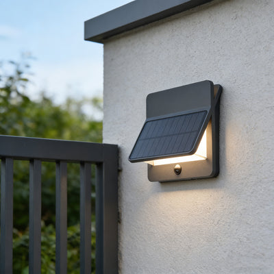 Solar-powered outdoor wall light attached to a house exterior with a solar panel.