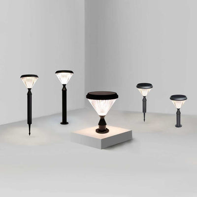 Set of modern outdoor solar lawn & pillar lights on a neutral background