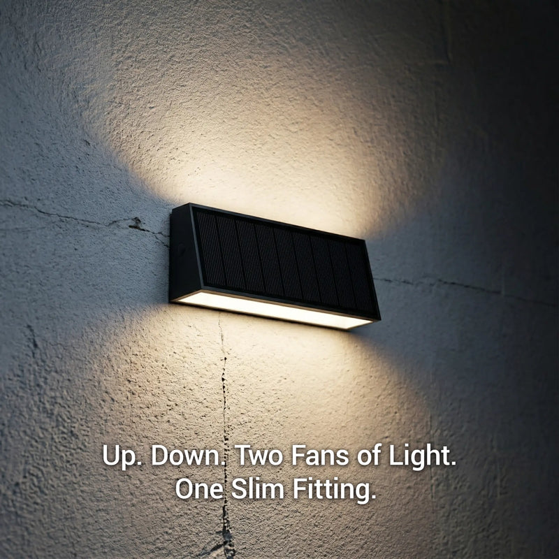 Tenox PT0716 solar wall light on textured wall showing dual up-and-down fan beams of warm white light at night