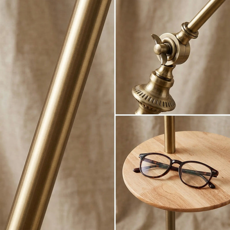 FL068 lamp detail close-ups: brushed gold electroplated pole, precision butterfly adjustment knob at the arc joint, and smooth natural wood tray with a pair of reading glasses