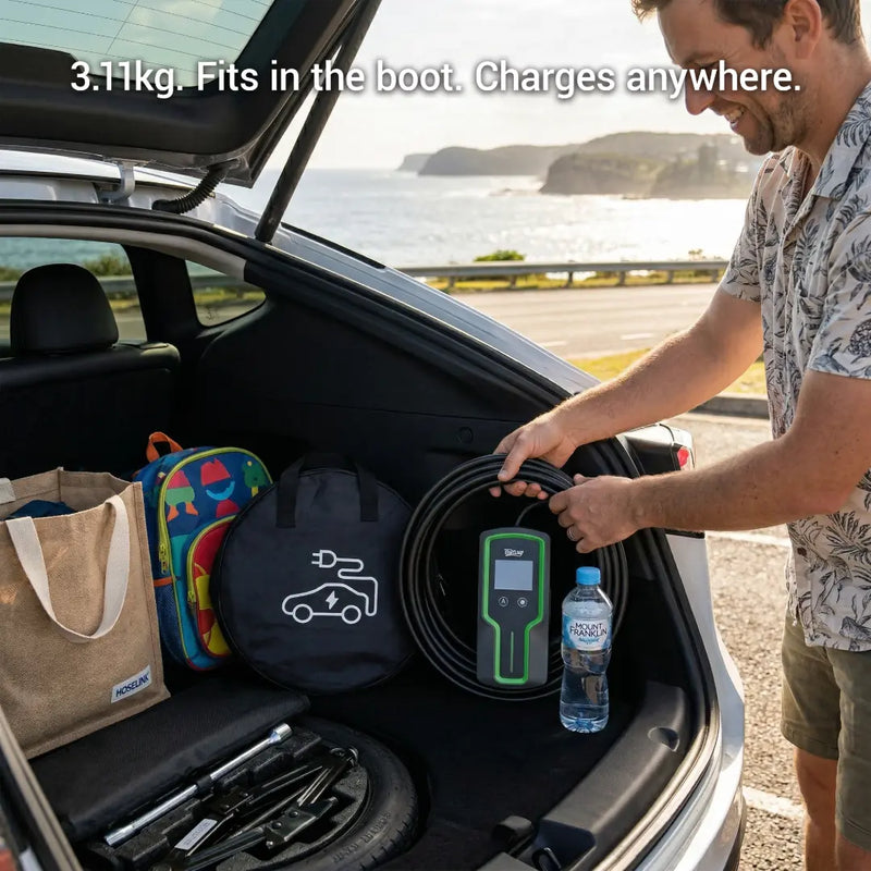 Man loading a charging cable into a car trunk with scenic background