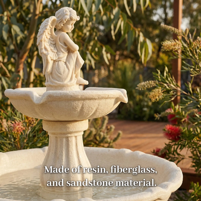 Close-up of OUTWAY angel solar garden fountain upper tier showing cream yellow winged angel statue and scalloped basin in an Australian native garden with bottlebrush and eucalyptus with text overlay Made of resin fiberglass and sandstone material