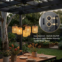 Outdoor setting with hanging lights and a solar panel control unit.