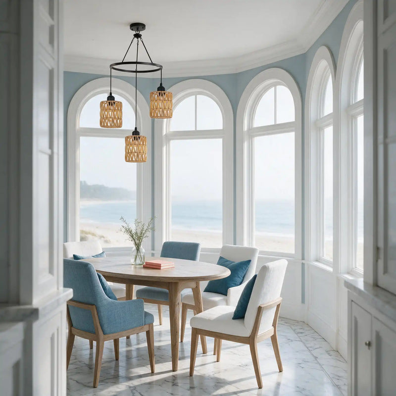 Modern rattan cluster light hanging in bright bay window dining area with ocean view