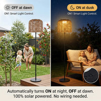 A split-screen comparison of the PT0908 Floor Lamp's smart light control: automatically off during the day on the left, and automatically on at night on the right with a mother and child playing in the courtyard, emphasizing the 'Automatically turns ON at night, OFF at dawn. 100% solar powered. No wiring needed.' convenience.