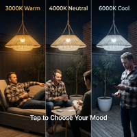 Three-panel comparison showing a hanging pendant light in different color temperatures: 3000K warm yellow, 4000K neutral, and 6000K cool white. Each panel includes people in a backyard patio setting under the light, with text reading '3000K Warm,' '4000K Neutral,' '6000K Cool,' and 'Tap to Choose Your Mood.