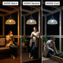 A woman easily swapping the modular solar panel on the top of the PT0901 Kiku Solar Rattan Hanging Lantern, highlighting the user-friendly design.